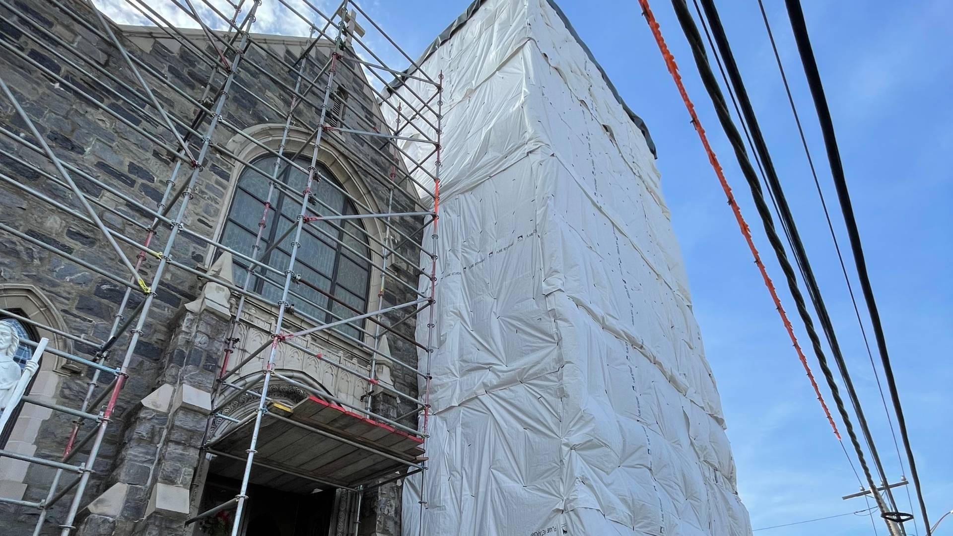 Building façade wrapped for restoration.